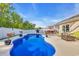 Sparkling backyard pool surrounded by a well-manicured lawn, patio, and lush greenery at 146 Brittmore Park Pl., Myrtle Beach, SC 29588