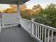 Private balcony with white railings and views of lush greenery and neighborhood at 1516 Edge Dr. # 101, North Myrtle Beach, SC 29582