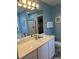 Bright bathroom featuring a single vanity, shower, and a walk-in closet for ample storage at 1516 Edge Dr. # 101, North Myrtle Beach, SC 29582