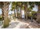 Convenient beach access path surrounded by lush palm trees at 1516 Edge Dr. # 101, North Myrtle Beach, SC 29582