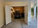 Spacious garage with golf cart, storage, and double door access at 1516 Edge Dr. # 101, North Myrtle Beach, SC 29582
