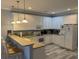 Bright kitchen featuring white cabinets, a breakfast bar, and modern appliances at 1516 Edge Dr. # 101, North Myrtle Beach, SC 29582