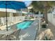 Community pool featuring a clear blue swimming pool, lounge chairs, and patio furniture at 1516 Edge Dr. # 101, North Myrtle Beach, SC 29582