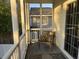 Cozy screened porch with comfortable seating, perfect for enjoying the outdoors at 1516 Edge Dr. # 101, North Myrtle Beach, SC 29582