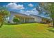 Spacious backyard featuring a lush lawn and a covered patio, perfect for outdoor entertaining at 1581 Culbertson Ave., Myrtle Beach, SC 29577
