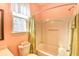 Bright bathroom featuring a shower/tub combo, neutral walls, and natural light at 1581 Culbertson Ave., Myrtle Beach, SC 29577