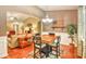 Well-lit dining area adjacent to the living room, with a wooden table and elegant decor at 1581 Culbertson Ave., Myrtle Beach, SC 29577