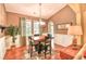 Elegant dining room with large windows, chandelier, and wainscoting creating a warm atmosphere at 1581 Culbertson Ave., Myrtle Beach, SC 29577