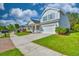 Charming blue two-story home with a well-manicured lawn and attached garage at 1581 Culbertson Ave., Myrtle Beach, SC 29577