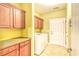 Functional laundry room includes washer, dryer, countertop space, and storage cabinets at 1581 Culbertson Ave., Myrtle Beach, SC 29577