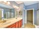 Well-appointed main bathroom featuring double sinks, a shower, and ample cabinet space at 1581 Culbertson Ave., Myrtle Beach, SC 29577