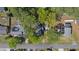 A birds eye view of a home with a fire pit and solar panels near a quiet residential street at 1623 27Th Ave. N, North Myrtle Beach, SC 29582