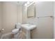 This half bathroom features a pedestal sink, tile floors, and neutral paint at 1623 27Th Ave. N, North Myrtle Beach, SC 29582