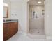 Bathroom with single vanity and a separate shower with a built-in bench at 1623 27Th Ave. N, North Myrtle Beach, SC 29582