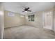 Bedroom featuring neutral carpet, fan, and a window bringing in natural light at 1623 27Th Ave. N, North Myrtle Beach, SC 29582