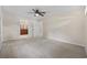 Spacious bedroom with neutral carpet, fan, and access to bathroom and closet at 1623 27Th Ave. N, North Myrtle Beach, SC 29582