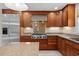 Close-up of the kitchen with stainless steel appliances and granite countertops, with hardwood cabinets at 1623 27Th Ave. N, North Myrtle Beach, SC 29582