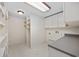 Laundry room with shelving, cabinets, and a folding counter for convenience at 1623 27Th Ave. N, North Myrtle Beach, SC 29582