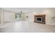 Bright living room with tile floors, fireplace, and natural light at 1623 27Th Ave. N, North Myrtle Beach, SC 29582