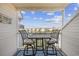 Cozy balcony seating area with a table overlooking the peaceful waterfront community at 1919 Spring St. # 36A, North Myrtle Beach, SC 29582