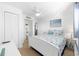 Bright bedroom with a full bed, coastal decor, and adjacent bathroom at 1919 Spring St. # 36A, North Myrtle Beach, SC 29582