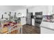 A modern, eat-in kitchen with stainless steel appliances, light wood flooring, and nautical-themed decor at 1919 Spring St. # 36A, North Myrtle Beach, SC 29582