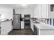 Fully equipped kitchen features stainless steel appliances, white cabinetry, and nautical-themed accents at 1919 Spring St. # 36A, North Myrtle Beach, SC 29582