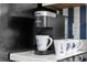 A kitchen countertop with a Keurig coffee maker and three coffee mugs with nautical designs at 1919 Spring St. # 36A, North Myrtle Beach, SC 29582