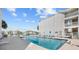 Community outdoor pool with lounge chairs surrounded by manicured landscaping and white buildings at 1919 Spring St. # 36A, North Myrtle Beach, SC 29582