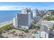 Aerial view of an oceanfront resort, street view, parking and community pool in a vibrant beach neighborhood at 2001 S Ocean Blvd. # 406, Myrtle Beach, SC 29577