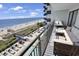 Enjoy ocean views from this spacious balcony with cushioned seating, a perfect spot for relaxation at 2001 S Ocean Blvd. # 406, Myrtle Beach, SC 29577
