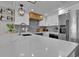 Well-equipped kitchen featuring sleek countertops, stainless steel appliances, and stylish lighting fixtures at 2001 S Ocean Blvd. # 406, Myrtle Beach, SC 29577