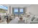 Bright and airy living room with coastal decor, comfortable seating, and access to a private balcony at 2001 S Ocean Blvd. # 406, Myrtle Beach, SC 29577
