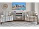 Cozy living area with comfortable chairs, fireplace, and a relaxing ambiance for enjoyable evenings at 2001 S Ocean Blvd. # 406, Myrtle Beach, SC 29577