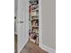 Well-organized pantry featuring shelving with food, baskets, and cleaning supplies, maximizing storage space at 2001 S Ocean Blvd. # 406, Myrtle Beach, SC 29577
