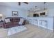 Inviting living area with a stylish leather sofa, kitchen breakfast bar, and a view of the modern kitchen at 202 Landing Rd. # B, North Myrtle Beach, SC 29582