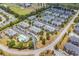 Aerial view of complex with a community pool, mature trees and shrubs, and parking at 2037 Silvercrest Dr. # 16E, Myrtle Beach, SC 29579