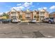 Condominium building with brick facade, multiple balconies, and ample parking on a sunny day at 2037 Silvercrest Dr. # 16E, Myrtle Beach, SC 29579