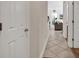 Inviting hallway with tile flooring leading to the living area and bedrooms at 2037 Silvercrest Dr. # 16E, Myrtle Beach, SC 29579