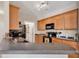 Well-lit kitchen with granite countertops, stainless steel appliances, and ample cabinet space at 2037 Silvercrest Dr. # 16E, Myrtle Beach, SC 29579