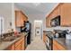 Compact kitchen with appliances and convenient access to the laundry area for added functionality at 2037 Silvercrest Dr. # 16E, Myrtle Beach, SC 29579