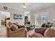 Bright and airy living room featuring tile flooring, comfortable sofas, and a view to the balcony at 2037 Silvercrest Dr. # 16E, Myrtle Beach, SC 29579