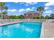 Outdoor community pool area with lounge chairs and palm trees providing a relaxing atmosphere at 2037 Silvercrest Dr. # 16E, Myrtle Beach, SC 29579