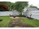Spacious backyard with fire pit, bench seating, and decorative landscaping at 2039 Chadbury Ln., Myrtle Beach, SC 29588