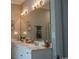 Bright bathroom featuring a large mirror with vanity lighting and a double sink with ample counter space at 2039 Chadbury Ln., Myrtle Beach, SC 29588