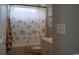 Cozy bathroom with a tub and a turtle-themed shower curtain at 2039 Chadbury Ln., Myrtle Beach, SC 29588