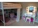 Charming bedroom featuring a loft bed, vanity, and plenty of storage and play space at 2039 Chadbury Ln., Myrtle Beach, SC 29588