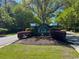 Community entrance sign surrounded by landscaped bushes and trees at 2039 Chadbury Ln., Myrtle Beach, SC 29588