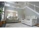 Bright living room featuring high ceilings, staircase, and neutral-toned furniture at 2039 Chadbury Ln., Myrtle Beach, SC 29588