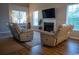 Cozy living room with a fireplace, natural light, and comfortable seating at 2039 Chadbury Ln., Myrtle Beach, SC 29588